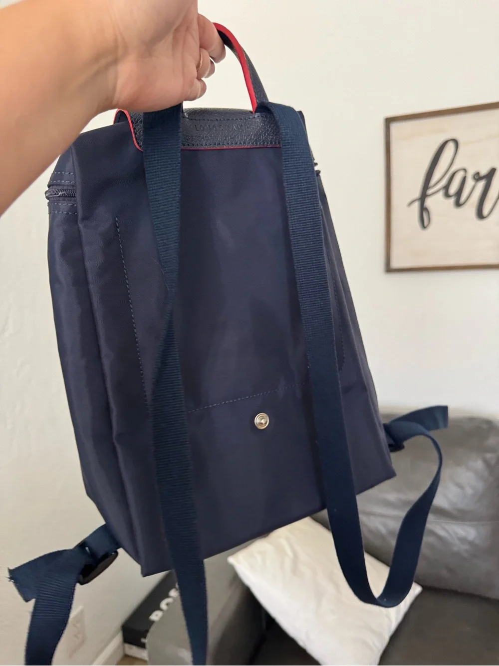 Longchamp navy backpack with red accents